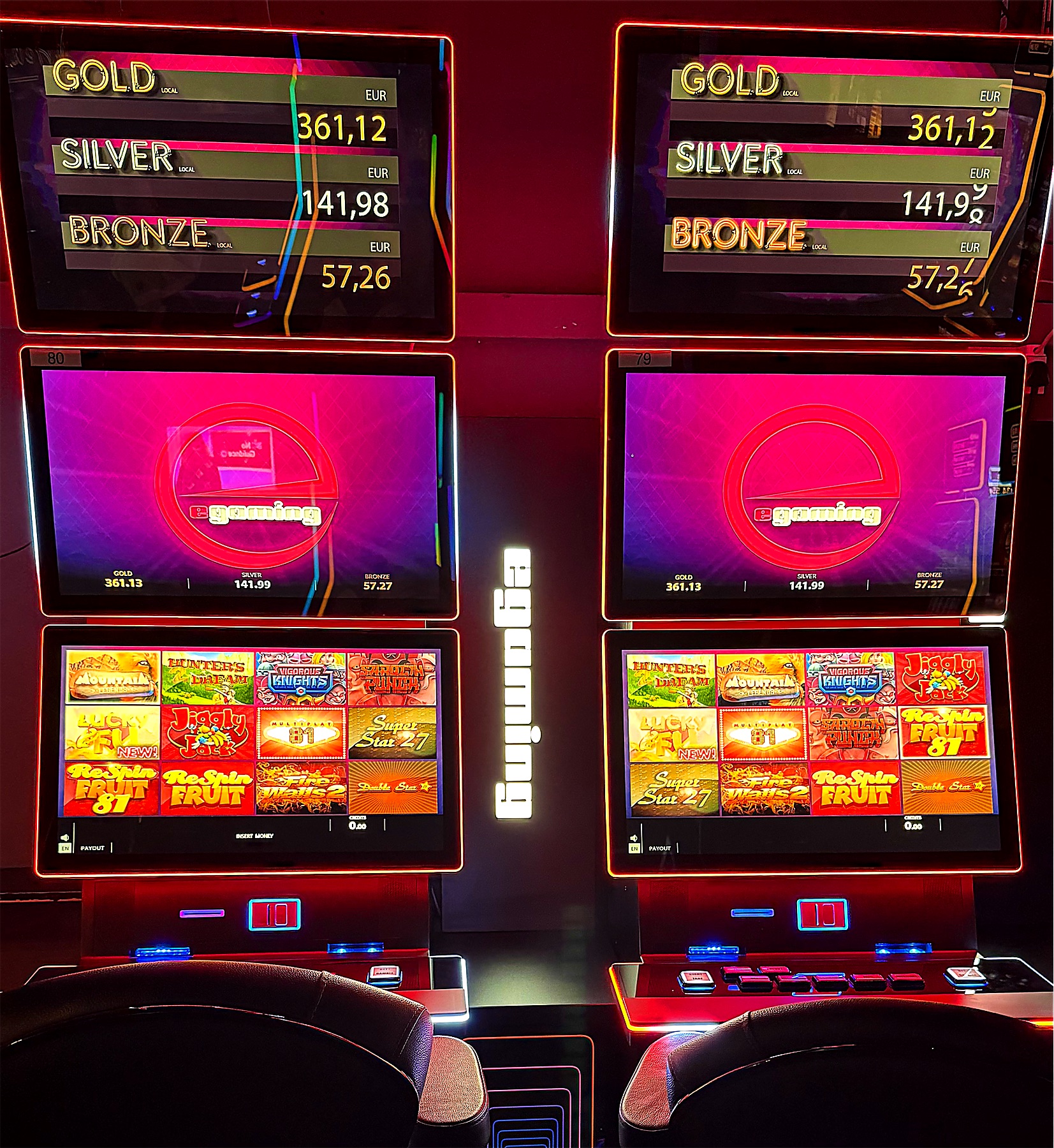 Two lit gaming cabinets